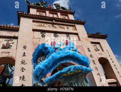 Lion Dance in front of a Temple gate, Central Java, Indonesia Stock Photo