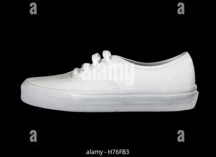 White fashionable canvas sneaker isolated on black Stock Photo