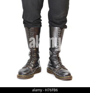 A pair of old and rugged men's/unisex knee-high black 20-eyelet lace-up combat boots Stock Photo