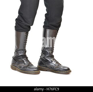 A pair of old and rugged men's/unisex knee-high black 20-eyelet lace-up combat boots Stock Photo