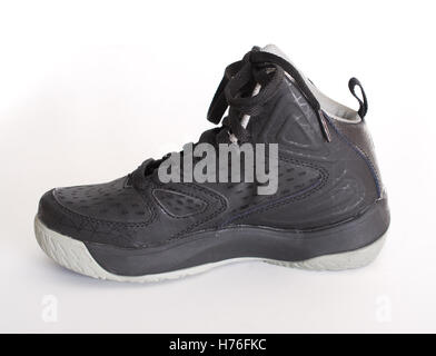 A children's modern high-top black leather and mesh basketball shoe,  sneaker isolated on white Stock Photo