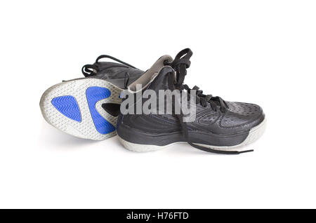 Children's modern high-top black leather and mesh basketball shoes,  sneakers showing the sole, isolated on white Stock Photo