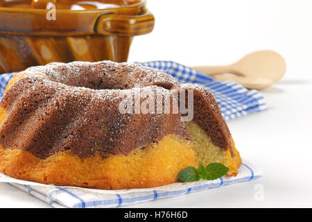 detail of marble bundt cake and bundt cake pan Stock Photo