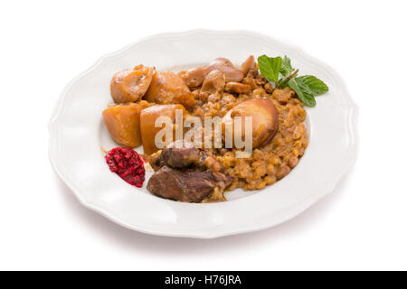 Traditional Jewish Cholent (Hamin) prepared is Israel as the main dish for the Shabbat meal made with beef, potato, beans, barle Stock Photo