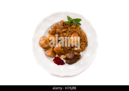 Traditional Jewish Cholent (Hamin) prepared is Israel as the main dish for the Shabbat meal made with beef, potato, beans, barle Stock Photo