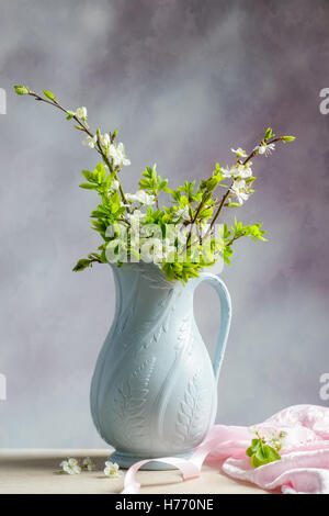 Spring apple blossom in antique jug Stock Photo