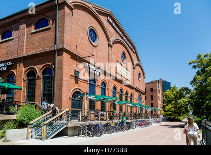 The old Denver Tramway Power building in Confluence Park on the Platte River. Now home to Starbucks and REI Stock Photo