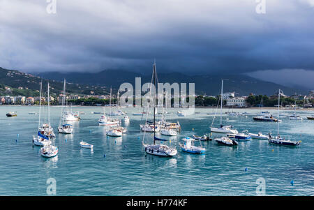 Small boat harbor of Sestri Levante, Liguria, Italy; dark cloudy sky shortly before a thunderstorm. Stock Photo