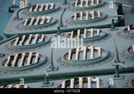 Old metallic window shutters mounted on a floor of ship, boat or yacht Stock Photo