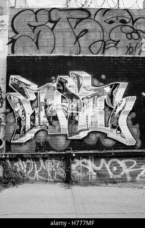 Graffiti wall mural street art along Meserole St in the East Williamsburg / Brunswick section of Brooklyn, New York City, USA Stock Photo