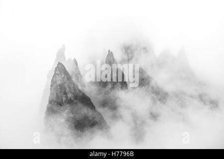 Dolomite Mountain Peaks in the Fog, Val Gardena, South Tyrol, Italy Stock Photo
