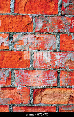 Red brick wall texture macro closeup, old detailed rough grunge cracked textured bricks copy space background, grungy vertical Stock Photo