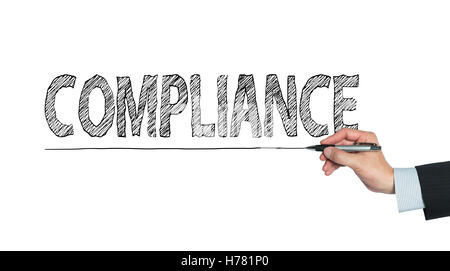 compliance written by hand, hand writing on transparent board, photo Stock Photo