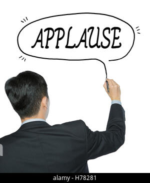 applause written by businessman in black suit, hand writing on transparent board, photo Stock Photo