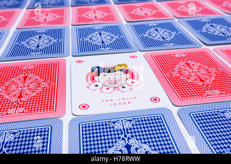 joker card among some playing cards Stock Photo