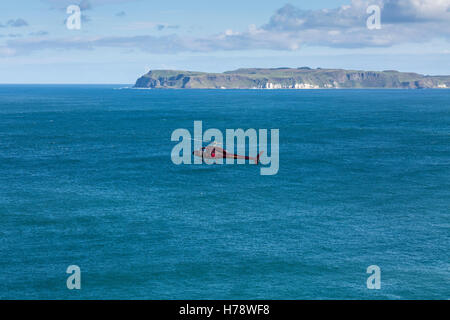 Aerospatiale AS355 Twin Squirrel 2 helicopter operated by PDG helicopters, PLM Dollar Group, flying over the North Antrim Coastl Stock Photo