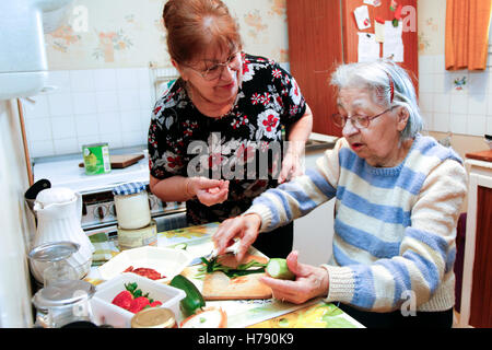 SENIOR IN KITCHEN Stock Photo