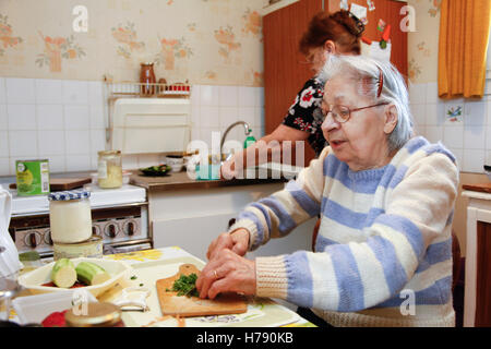 SENIOR IN KITCHEN Stock Photo