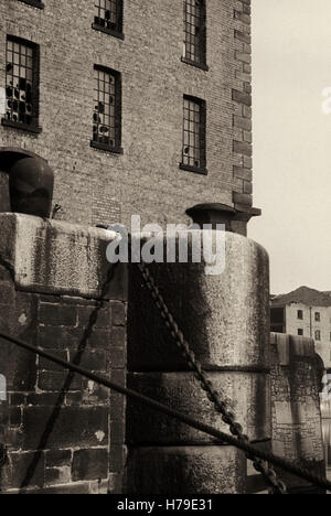 The Albert Dock, designed by Jesse Hartley,  was opened in 1846, was the first structure in Britain to be built from cast iron, brick and stone and was the first non-combustible warehouse system in the world. Photographed around 1976 before it was renovated following the Toxteth Riots of 1981, Liverpool City, Merseyside, Lancashire, England Stock Photo