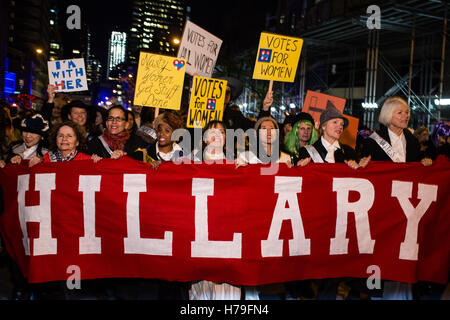 New York, NY - 31 October 2016. Marchers in support of Hillary Clinton marrch behind a banner that simply reads 'Hillary' in the Stock Photo