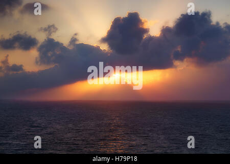 golden sunset on the sea with sun rays Stock Photo