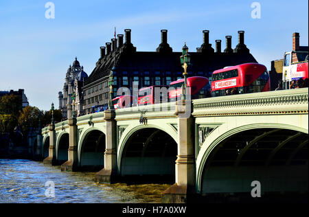 London, England, UK. Double Decker buses crossing Westminster Bridge towards Portcullis House Stock Photo