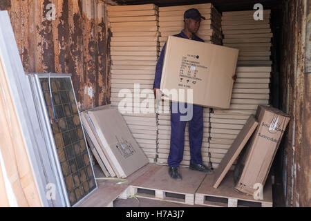 Rural electrification and solar energy in sub-Saharan Africa. -  04/03/2016  -    -  Koutiala (Mali), March 2nd, 2016: Mamadou Keita, a storekeeper, come to get solar pannels in a container for a future installation.   -  Nicolas Remene / Le Pictorium Stock Photo
