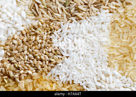 Abstract pattern made of white, brown and parboiled rice from above. Stock Photo