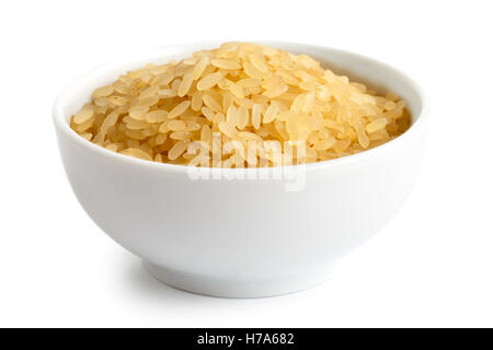 Bowl of short grain parboiled rice isolated on white. Stock Photo