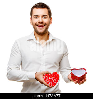 Young man carries heart shaped box Stock Photo