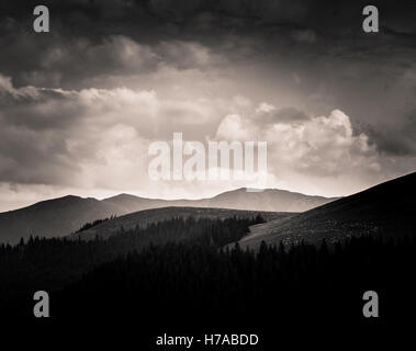 Dramatic clouds over Carpathian mountains in gray scale Stock Photo