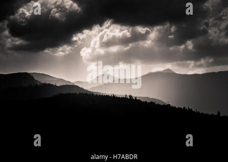 Dramatic clouds over Carpathian mountains in gray scale Stock Photo