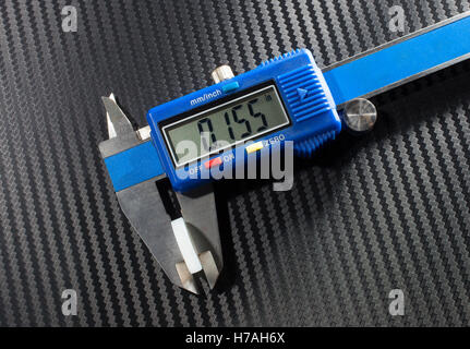 Digital caliper that is measuring the wad in a shotshell Stock Photo