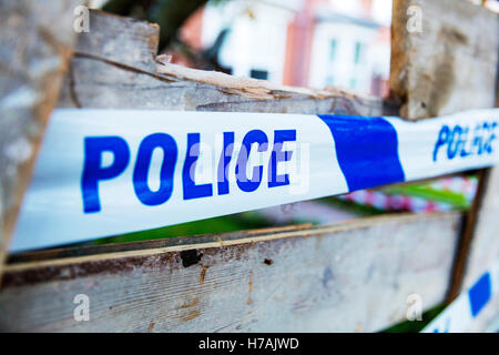 Police tape used to let people know police are aware of incident keep out police sign UK England GB Stock Photo