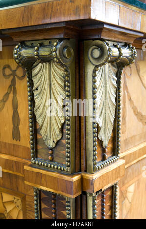 Decorative gold leaf scrolls on corners of the Minerva and Diana Commode, Harewood House, 1773 Stock Photo
