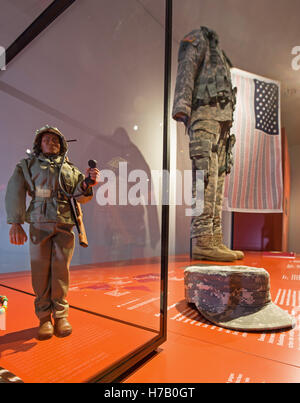 Bremen, Germany. 03rd Nov, 2016. A small figure of a soldier in a display case (L) represents a Nanajo Indian as a US soldier at the Uebersee Museum Bremen in Bremen, Germany, 03 November 2016. A US Army uniform is displayed in the background. The installation is part of the newly built permanent exhibit 'America' and refers to the military power of the USA. The new exhibit on the double-continent re-opens 06 November 2016. Photo: INGO WAGNER/dpa/Alamy Live News Stock Photo