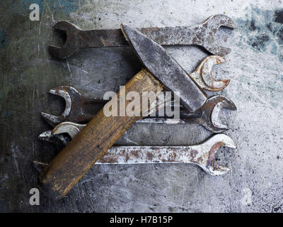 November 3, 2016 - Old rusty wrench and hummer on metal background © Igor Golovniov/ZUMA Wire/Alamy Live News Stock Photo