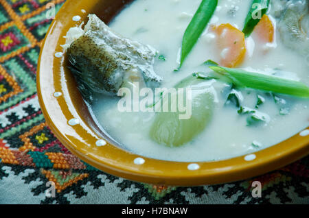 Zupa rybna - vintage Fish soup in Galichyna with sour cream and dumplings Stock Photo
