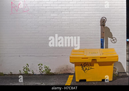 Yellow box, blue water shut off pipe Stock Photo