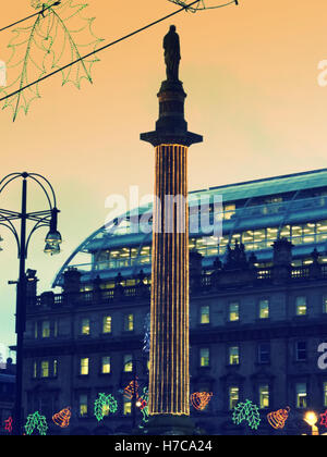 Glasgow Loves Christmas celebration George Square lights sir Walter Scott statue decorations Glasgow Christmas Market Stock Photo