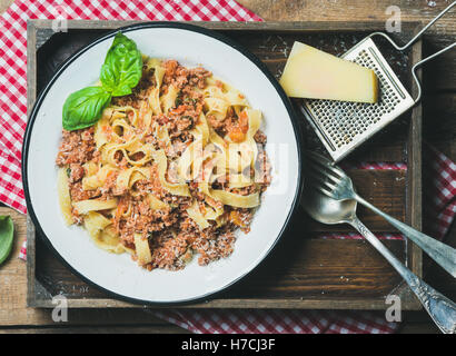 Italian pasta dinner with Parmesan cheese and fresh basil Stock Photo