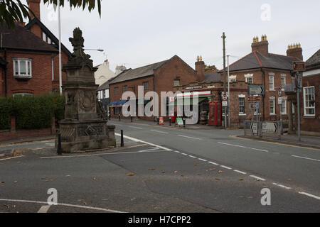 Hawarden village centre showing the Gladstone memorial fountain and the Post Office Stock Photo