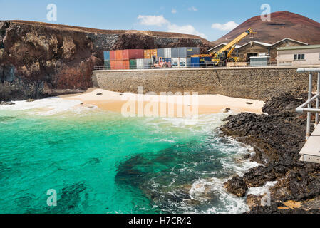 Ascension Island Wharf showing the container area and turquoise sea Stock Photo