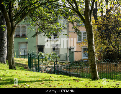 Autumn colours in a park and on a colourfully painted terrace in Montpelier Bristol. Stock Photo