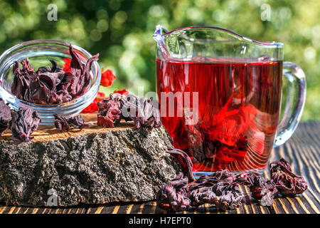 hibiscus tea karkade collection on a wooden table outdoors Stock Photo