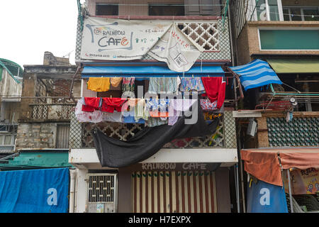 Washing Hanging Out To Dry Above The Rainbow Cafe On Cheung Chau Island, Hong Kong. Stock Photo