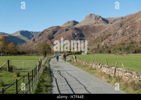 A couple cycling in the Langdale Valley, Lake District, UK. Stock Photo