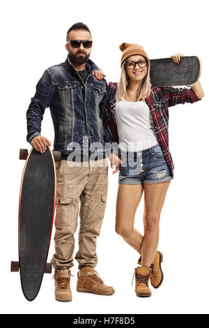 Full length portrait of male skater with a longboard and a female skater with a skateboard isolated on white background Stock Photo