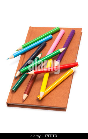 pencils and notebook on a white background Stock Photo