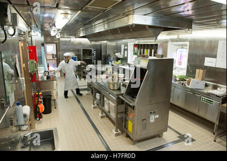 Chef cooking in galley on board a merchant ship Stock Photo